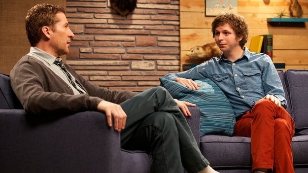 Michael Cera Wears a Blue Denim Shirt Red Pants